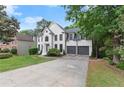 Inviting two-story home featuring a two-car garage and well-maintained lawn and landscaping at 4294 Silver Peak Pkwy, Suwanee, GA 30024