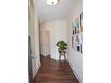 Welcoming entryway featuring hardwood floors, crisp white walls, and tasteful decor at 7624 Squire Ct, Fairburn, GA 30213