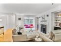 Bright living room features a fireplace, hardwood floors, and white walls at 2638 Vinings Central Se Dr # 4, Atlanta, GA 30339