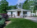 Charming home featuring a well-manicured lawn, shutters, and stone accents at 2660 Birch Se St, Smyrna, GA 30080
