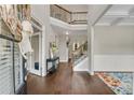 Spacious foyer with hardwood flooring, a staircase, and a view to the second story landing at 4285 Hunters Walk Way, Cumming, GA 30028