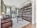 Bright office space featuring hardwood floors, custom shelving, and an abundance of natural light at 1110 Parkview Se Pl, Smyrna, GA 30080