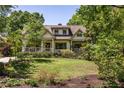 Lovely home with manicured lawn and mature trees providing shade and privacy at 164 Ridley Cir, Decatur, GA 30030