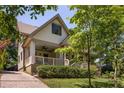 Inviting covered porch with classic columns and a charming seating area, perfect for relaxation at 164 Ridley Cir, Decatur, GA 30030
