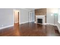 Living room featuring hardwood floors, a fireplace, and neutral walls at 2607 Jefferson Ter, Atlanta, GA 30344