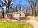 Charming home with new walkway and landscaping, nestled among mature trees at 2710 Hedgewood Nw Dr, Atlanta, GA 30311