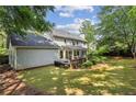 Lovely home exterior featuring a deck, sunroom, and a well-maintained backyard at 3322 Woodsfield Ne Dr, Marietta, GA 30062