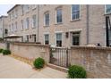 Townhouse patio featuring a brick facade, patio furniture, and manicured landscape at 3433 Landen Pine Ne Ct, Atlanta, GA 30305