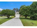Quaint two-story home with a long driveway and lots of mature trees at 2320 Crystal Ct, Loganville, GA 30052