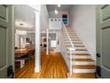 Inviting foyer showcasing hardwood floors, a staircase, and open sightlines to living and dining areas at 4569 Fountain Ne Dr, Marietta, GA 30067