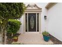 Elegant front door with decorative glass and manicured landscaping at 1931 Abinger Way, Lawrenceville, GA 30043