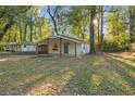 Street view of a well-kept single-story home with a covered porch and lush greenery surrounding the property at 2917 Reveille Se Cir, Atlanta, GA 30316