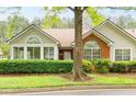Inviting home with red brick, lush front yard, and large windows, offering a blend of comfort and curb appeal at 3746 Vineyards Lake Nw Cir # U6, Kennesaw, GA 30144
