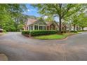 Residential street view of homes with well-kept landscaping and mature trees in a suburban neighborhood at 3746 Vineyards Lake Nw Cir # U6, Kennesaw, GA 30144
