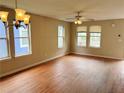 Spacious living room with natural light, hardwood floors, and elegant light fixtures, creating a warm ambiance at 1177 Arlington Sw Ave, Atlanta, GA 30310