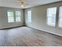 Bright living room featuring modern flooring and large windows that flood the space with plenty of natural light at 1177 Arlington Sw Ave, Atlanta, GA 30310