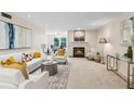 Bright living room with fireplace, neutral paint, stylish furniture, and modern decor at 66 Devon Ln, Avondale Estates, GA 30002