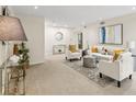 Spacious living room featuring neutral tones, stylish decor, and ample natural light at 66 Devon Ln, Avondale Estates, GA 30002
