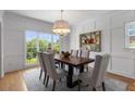 Elegant dining room features stylish decor, large window and a modern chandelier at 1077 Shady Valley Ne Pl, Atlanta, GA 30324