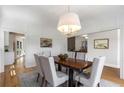 Elegant dining room features stylish decor, a modern chandelier, and views to other rooms at 1077 Shady Valley Ne Pl, Atlanta, GA 30324