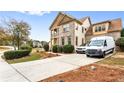 Lovely two-story home with brick and siding, landscaped front yard and long paved driveway at 1114 Ivey Chase Pl, Dacula, GA 30019