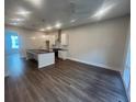New eat-in kitchen has a black island, stainless appliances, and hardwood floors at 128 Bert Lane Se # 167, Atlanta, GA 30316