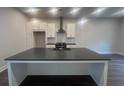New kitchen boasts an island, modern appliances, and stylish pendant lighting at 128 Bert Lane Se # 167, Atlanta, GA 30316