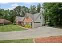 This traditional brick home includes an attached two-car garage and inviting landscaping at 2297 Ironwood Hill Ct, Dacula, GA 30019