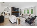 Bright living room with fireplace, contemporary decor, plush seating, and lots of natural light at 572 Cresentry Brk, Smyrna, GA 30082