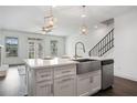 Modern kitchen with a large island, stainless steel sink, and stainless steel appliances at 244 Church St, Lawrenceville, GA 30046