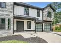 Charming two-story home features a welcoming entryway and a convenient two-car garage at 2740 Drew Valley Ne Rd, Brookhaven, GA 30319