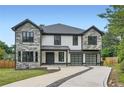 Beautiful two-story home features stone accents, a two-car garage, and a well-manicured front yard at 2740 Drew Valley Ne Rd, Brookhaven, GA 30319