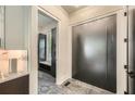 Elegant foyer features marble floors, a sleek front door, and a glimpse of a mudroom at 2740 Drew Valley Ne Rd, Brookhaven, GA 30319