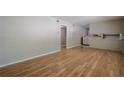 Bright living room with hardwood floors, neutral paint, and doorway leading to other rooms at 3710 A B Lynn Dr, Powder Springs, GA 30127