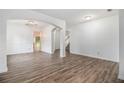 Bright living room with hardwood floors and an open floor plan at 7454 Silver Arrow Se Trl, Austell, GA 30168
