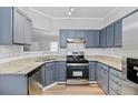 Well-lit kitchen featuring stainless steel appliances and subway tile backsplash at 3315 Brookfield Dr, Austell, GA 30106