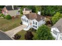 Aerial view of a well-maintained two-story home with lush landscaping and a driveway, showcasing its curb appeal at 440 Hickory Glen Sw Ln, Atlanta, GA 30311