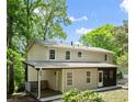 Rear view of a lovely home featuring a back deck and lush backyard at 1627 Rex Dr, Marietta, GA 30066