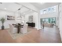 Bright and spacious dining room with elegant lighting and modern decor at 2505 Kirkwood Dr, Cumming, GA 30041