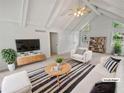 Bright living room featuring vaulted ceilings, modern decor, and neutral colors at 527 Tomahawk Trl, Woodstock, GA 30188