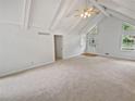 Bright living room featuring vaulted ceilings and neutral colors at 527 Tomahawk Trl, Woodstock, GA 30188