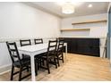 A dining room features modern light fixture and new flooring at 3135 Seven Pines Ct # 101, Atlanta, GA 30339