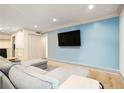 Living area showcases light wood floors, a flat screen television, and fresh paint at 3135 Seven Pines Ct # 101, Atlanta, GA 30339