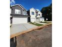 Two-story home with a gray exterior and white garage door at 4011 Redan Rd # 8, Stone Mountain, GA 30083