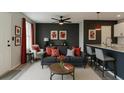 Comfortable living room featuring stylish decor, a ceiling fan, and seamlessly attached kitchen area at 4011 Redan Rd # 8, Stone Mountain, GA 30083