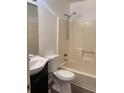 Full bathroom features a shower and tub combination with a single sink vanity at 1047 Plantation Way, Kennesaw, GA 30301