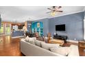 Open-concept living room with hardwood floors, stylish furnishings, and seamless flow to the kitchen at 396 15Th Nw St # 6, Atlanta, GA 30318