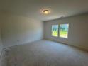 Spacious bedroom with two windows that offer ample natural light and a neutral color palette at 1006 Starmoss Lane, Conyers, GA 30094