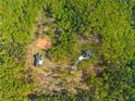 Aerial view shows two homesites surrounded by a forest landscape at 281 Abbott Dr, Canton, GA 30114
