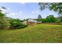 Spacious backyard with a mix of lawn, mature trees, and partial privacy fence offering great outdoor living at 3909 Ebenezer Rd, Marietta, GA 30066